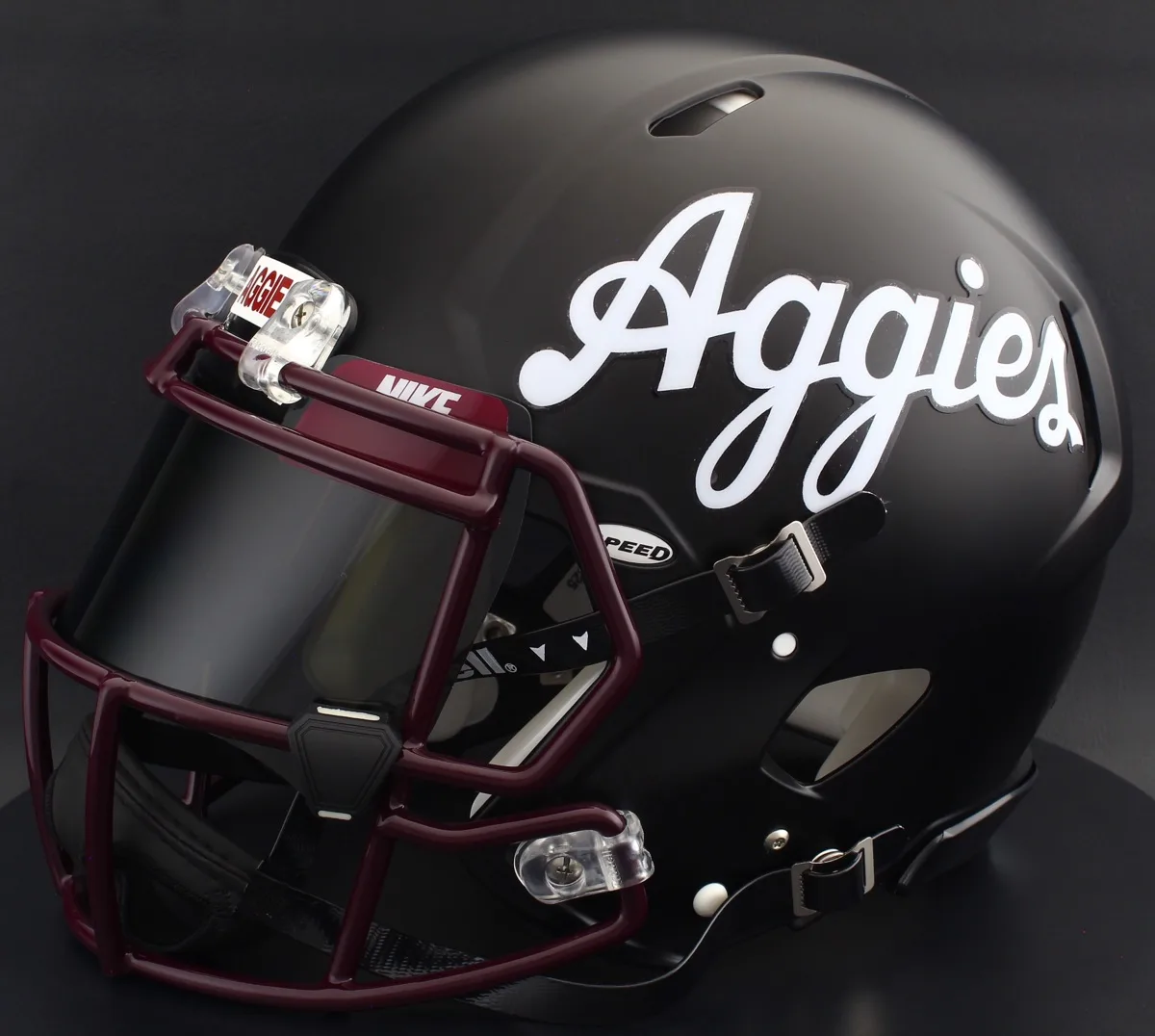 New Mexico State Aggies Riddell Authentic Speed Football Helmet – Matte Black Script Aggies, Maroon Facemask, Black Visor, Maroon Brow Tabs, and Black Clips