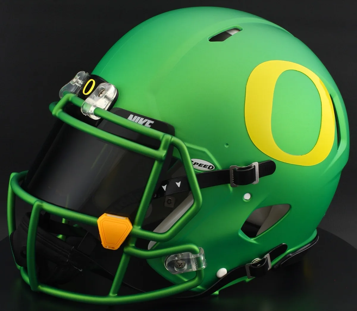 Oregon Ducks Riddell Replica Speed Football Helmet – Metallic Green Block “O”, Green Facemask, Black Visor, Black Brow Tabs, and Yellow Clips