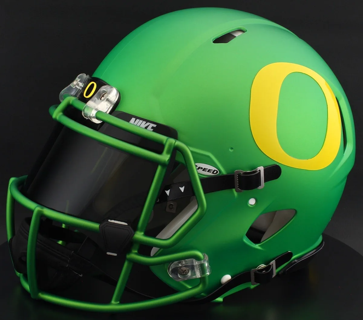 Oregon Ducks Riddell Replica Speed Football Helmet – Metallic Green Block “O”, Green Facemask, Black Visor, Black Brow Tabs, and Black Clips