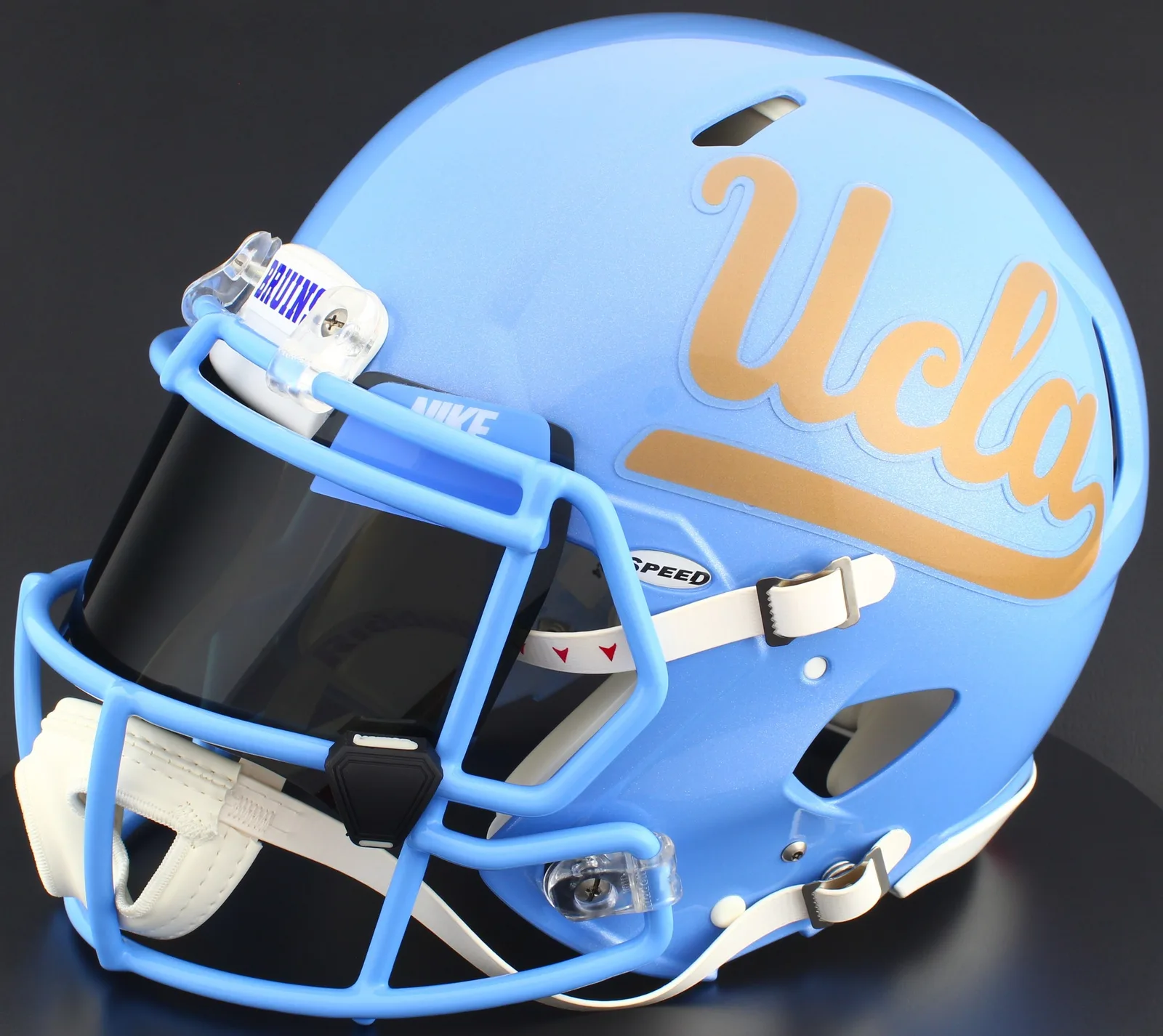 UCLA Bruins Riddell Authentic Speed Football Helmet – Gold Script UCLA, Tar Heels Blue Mask, Nike Black Visor, Powder Blue Brow Tabs, and Black Clips