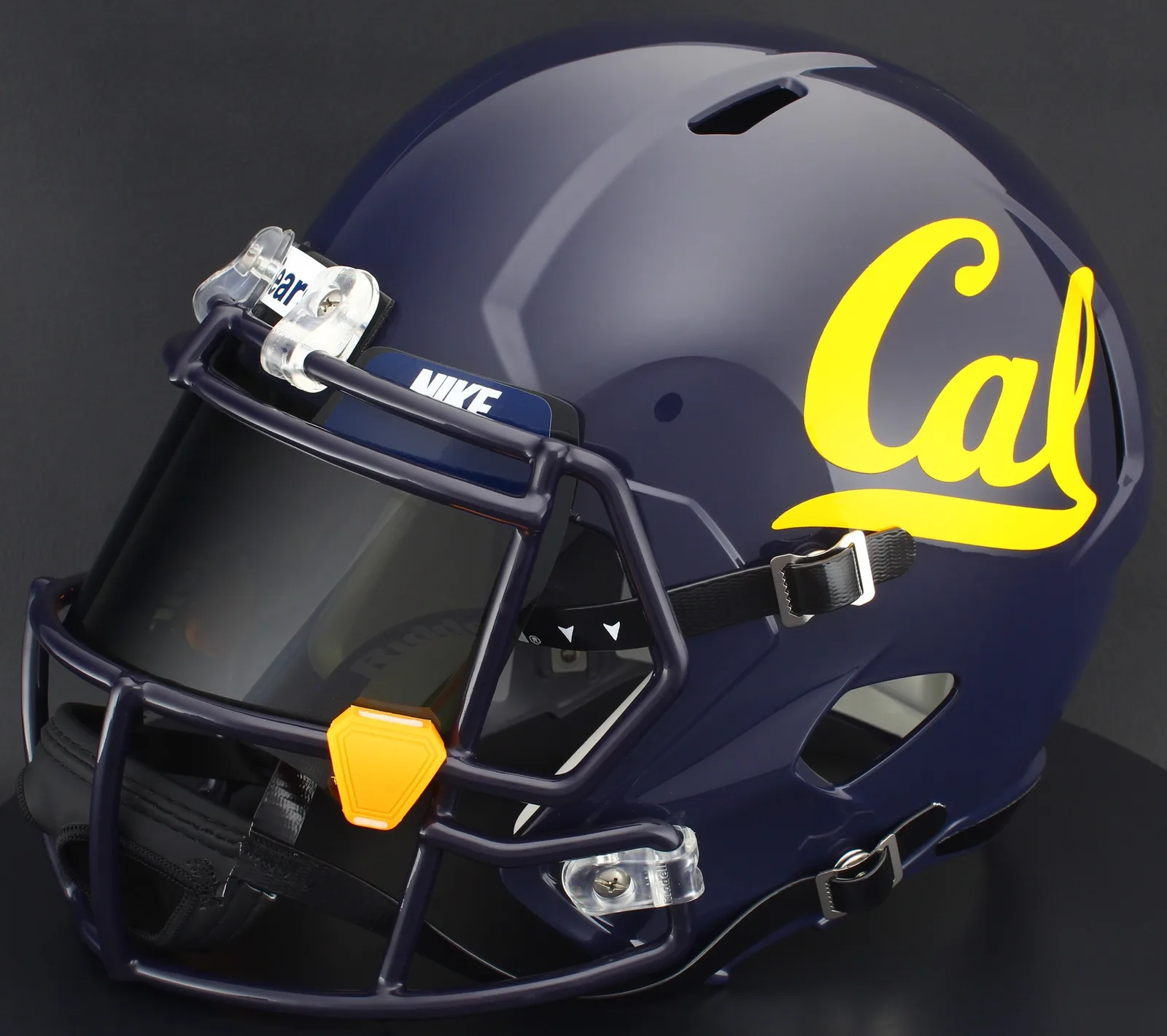 California Golden Bears Riddell Replica Speed Football Helmet – Navy Script Cal, Navy Blue Factory Mask, Nike Black Visor, Navy Blue Brow Tabs, and Yellow Clips