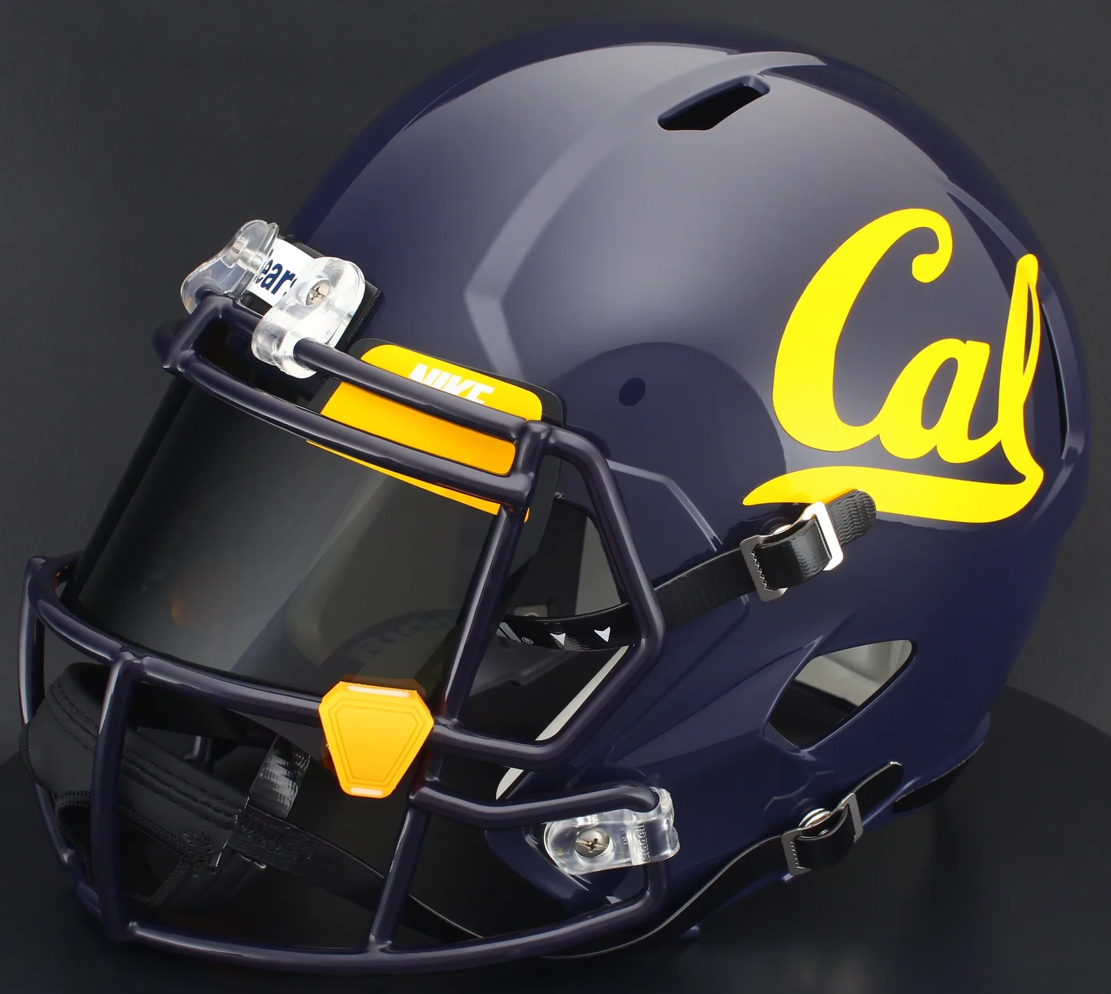 California Golden Bears Riddell Replica Speed Football Helmet – Navy Script Cal, Navy Blue Factory Mask, Nike Black Visor, Yellow Brow Tabs, and Yellow Clips